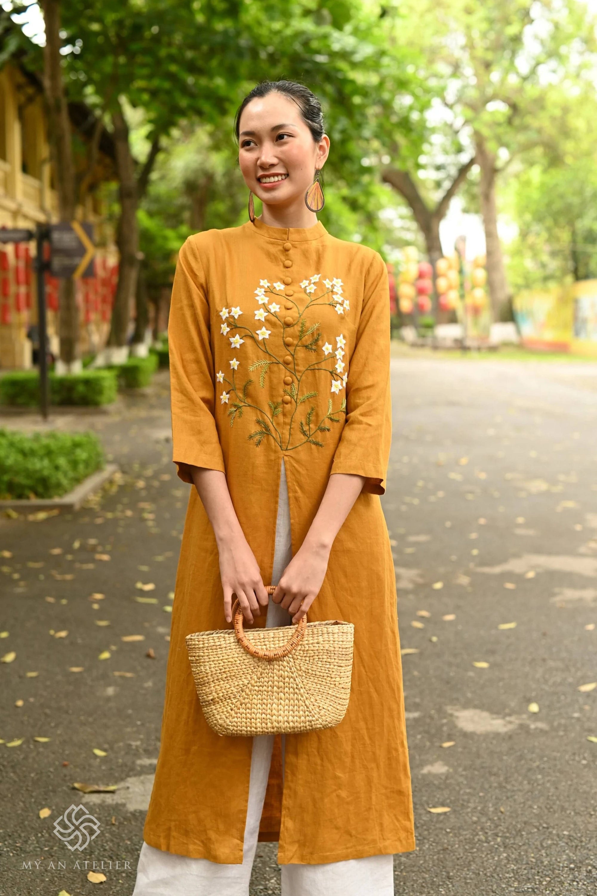 Hand-embroidered linen ao dai for Tet