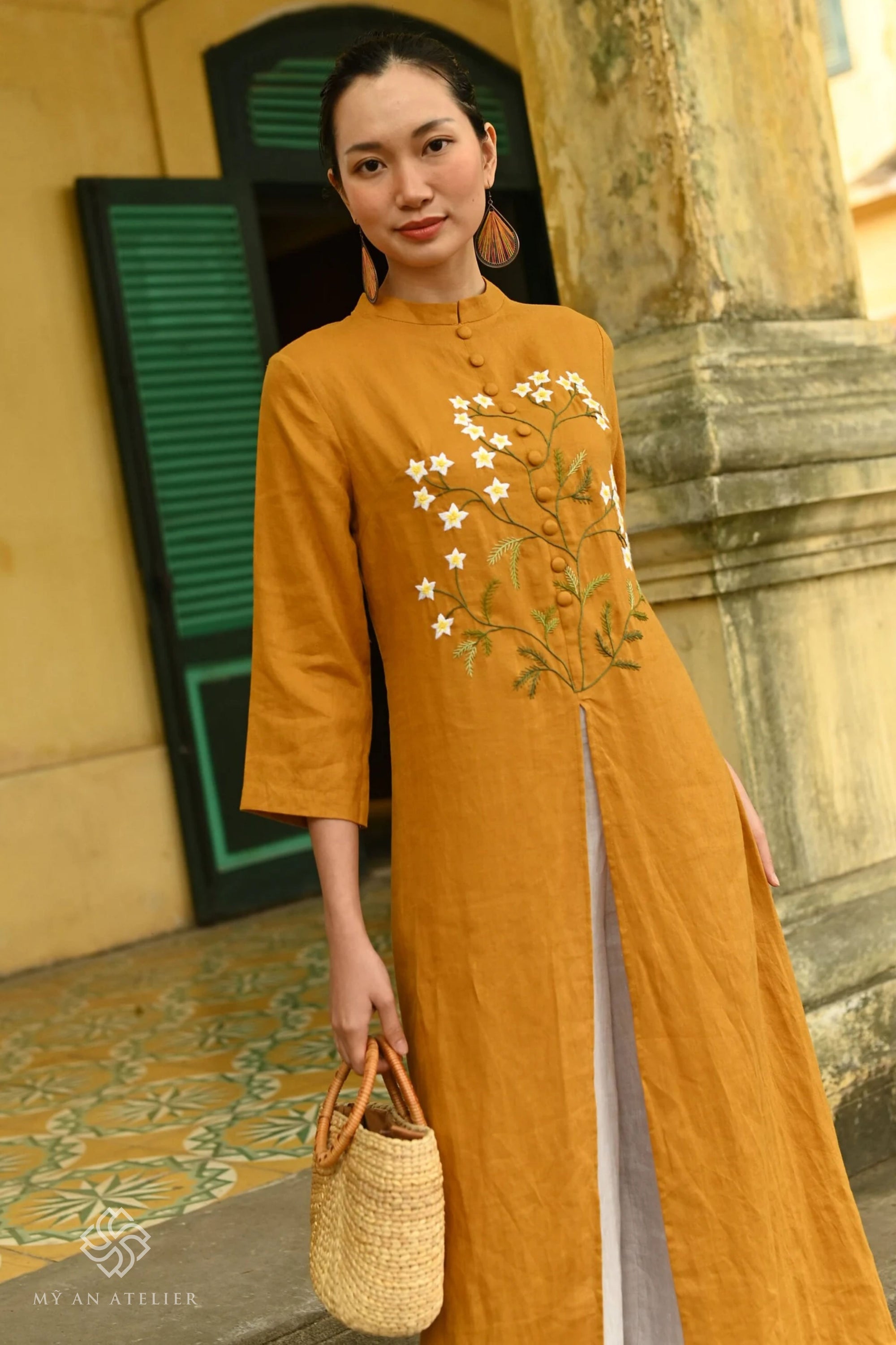 Hand-embroidered linen ao dai for Tet