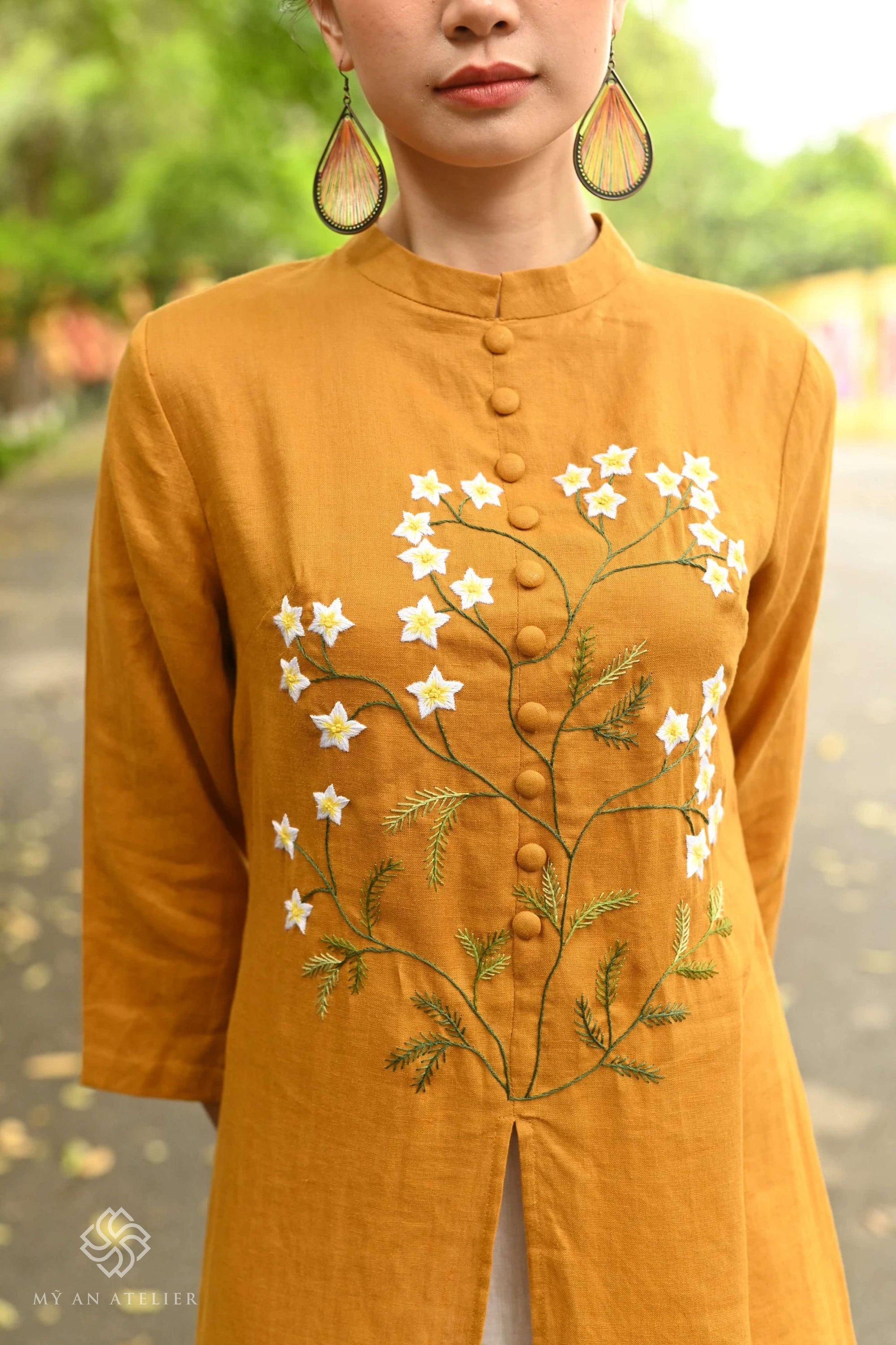 Hand-embroidered linen ao dai for Tet