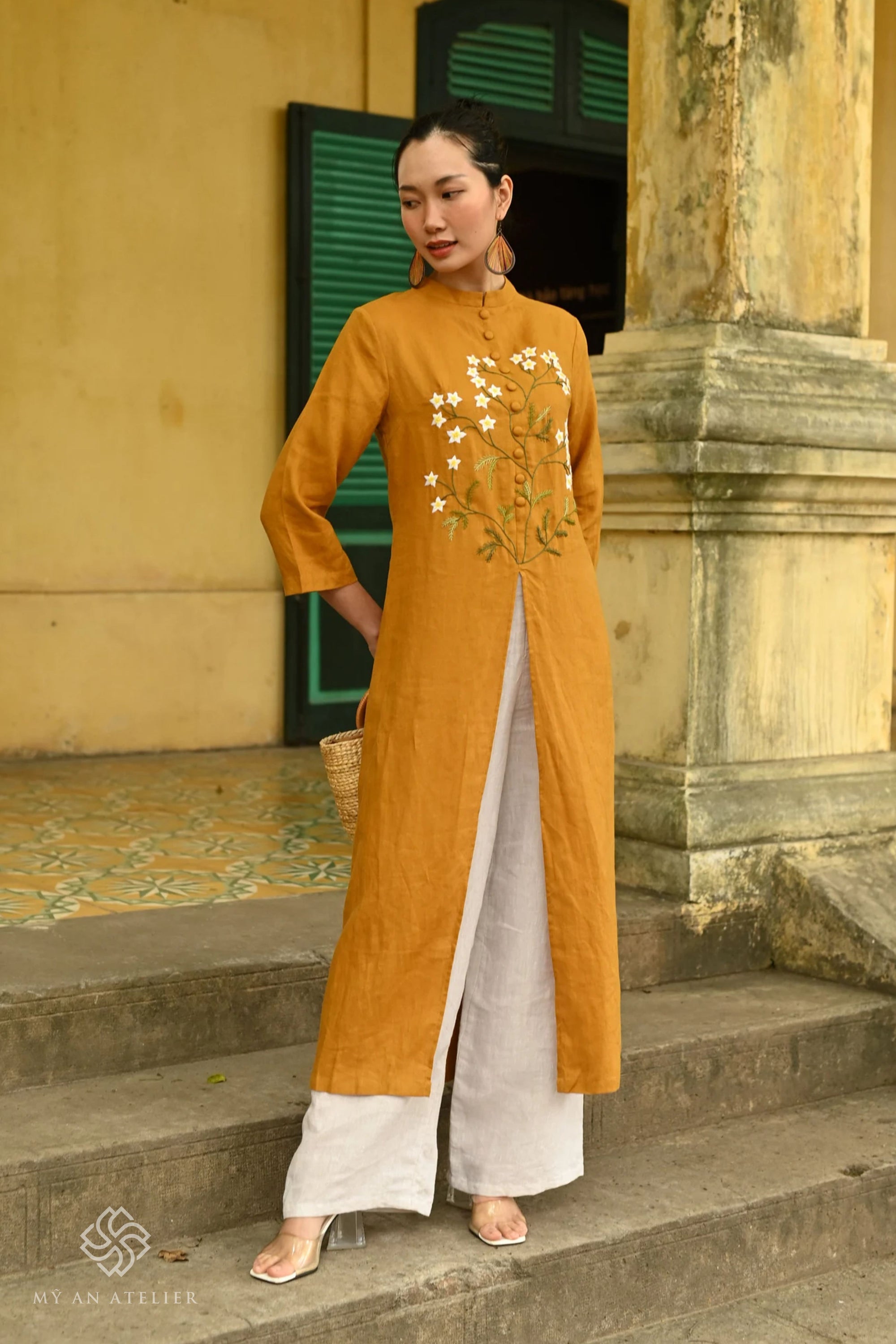 Hand-embroidered linen ao dai for Tet